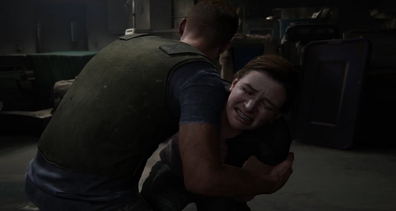 9.  Flashback: Abby con su padre en el hospital: Un recuerdo muestra a Abby con su padre Jerry, el cirujano que Joel mató. La escena revela su origen como antagonista y su conexión con las Luciérnagas. (Crédito: Naughty Dog / PlayStation)